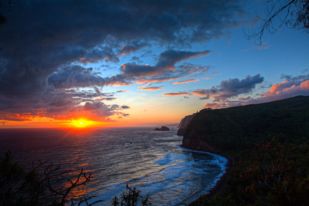 See waiānuenue falls, a roaring waterfall where visitors can often spot a rainbow in the surrounding mist; 4 Incredible Spots To Watch A Sunrise On The Big Island Hawaii Photography Tours